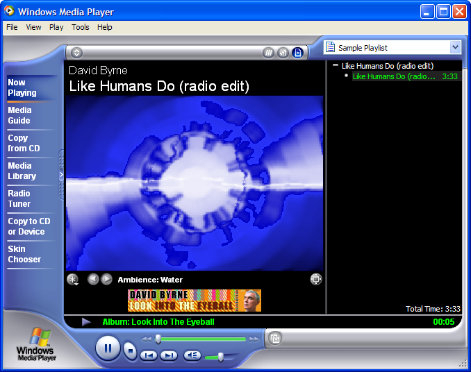 Windows Media Player playing David Byrne's Like Humans Do with a blue swirling visualiser