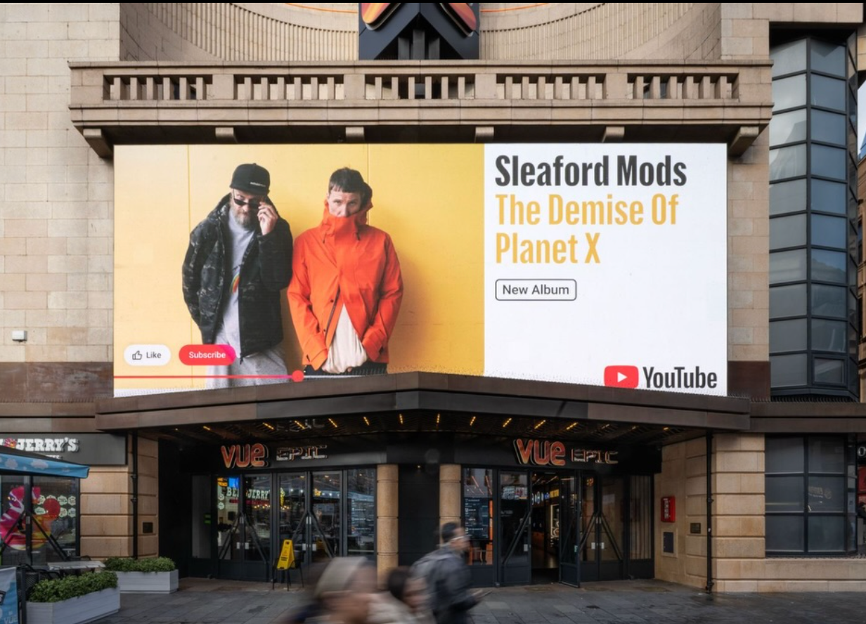 Billboard for Sleaford Mods' The Demise of Planet X above a Vue cinema entrance
