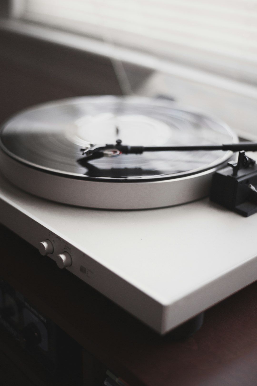 White turntable playing music