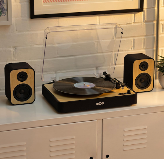 House of Marley Revolution turntable with a pair of bamboo-fronted speakers