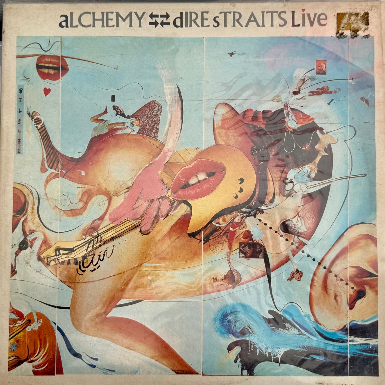 Dire Straits' Alchemy Live cover from our own collection - a busy, colourful surreal painting