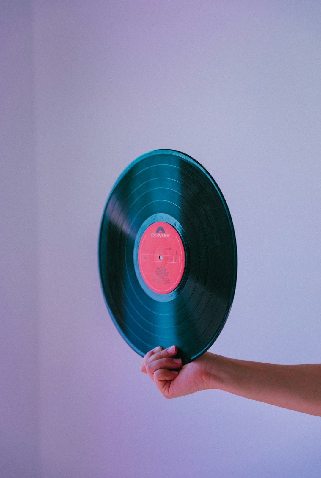 Hand holding the vinyl of Super Trouper by ABBA