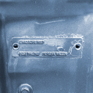 Single cover for I Had Some Help by Post Malone and Morgan Wallen - the title stamped on a metal plate