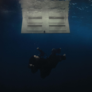 Billie Eilish album cover for Hit Me Hard and Soft - a figure sinking underwater beneath a door