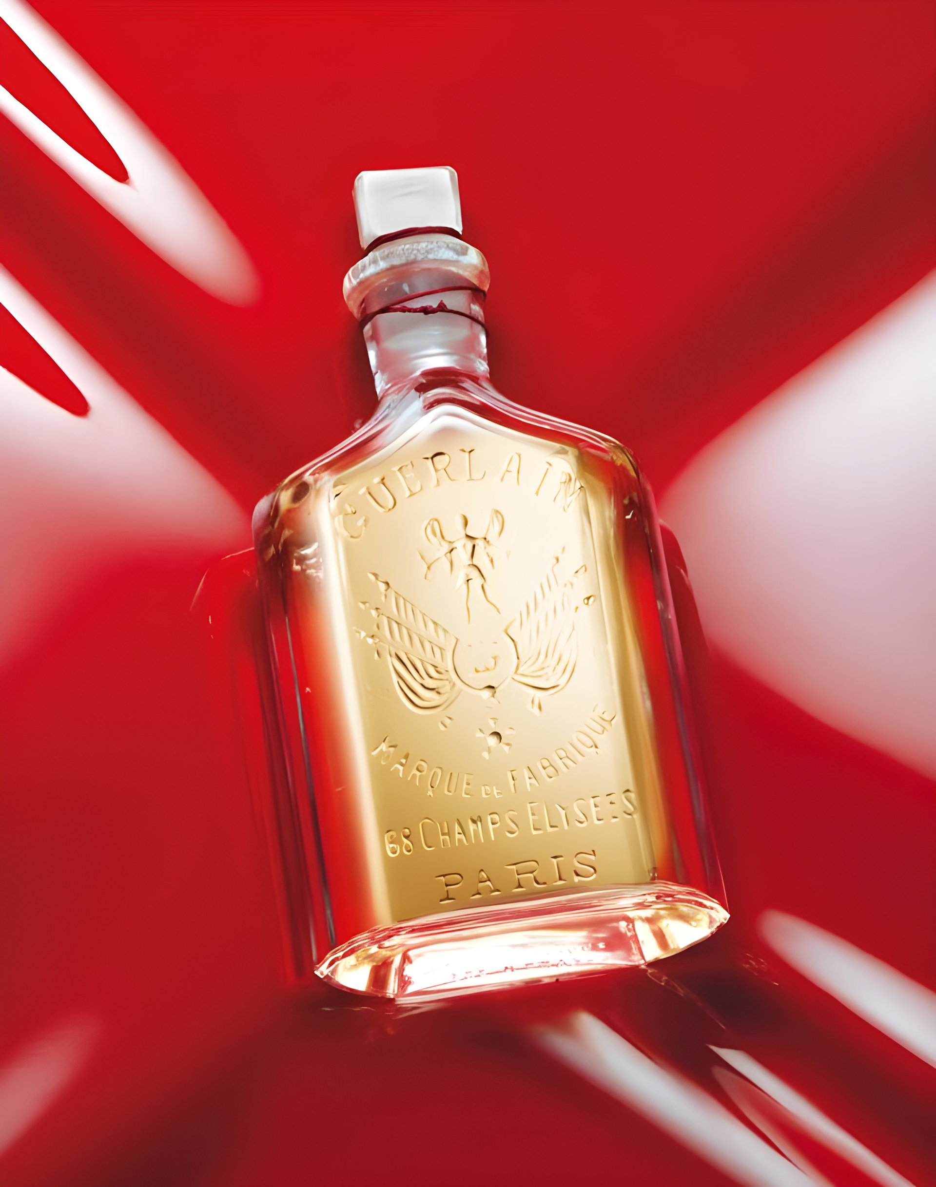Habit Rouge Armoiries by Guerlain perfume bottle