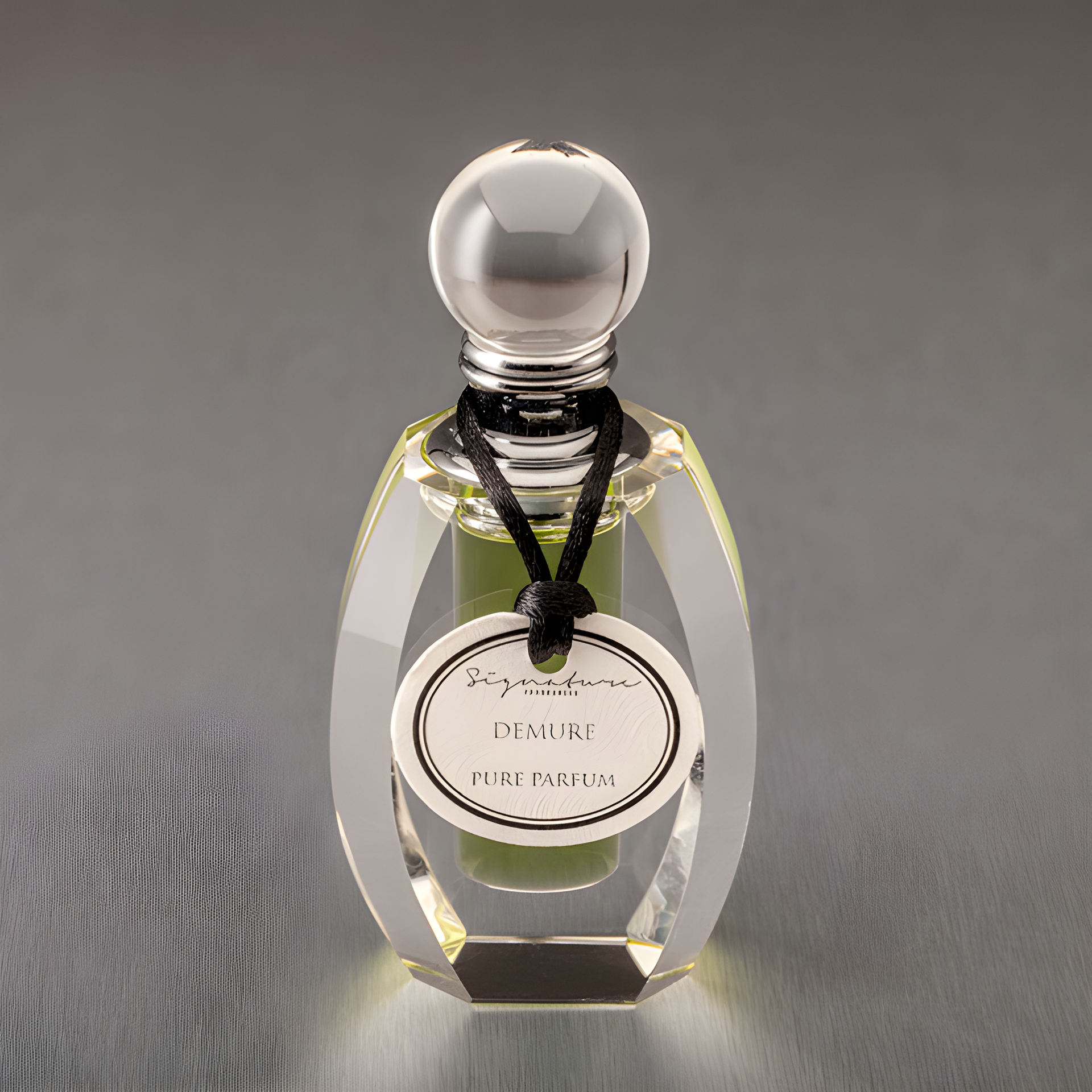 Demure by Signature Fragrances perfume bottle